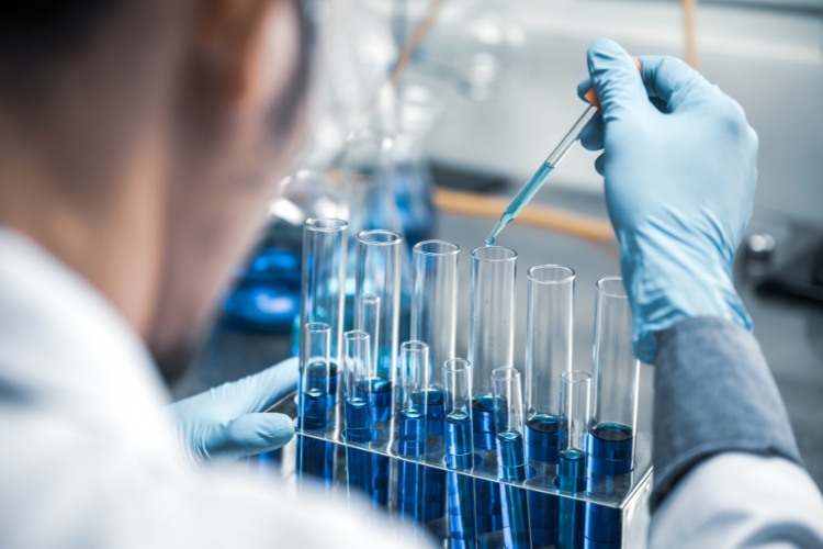 Laboratory technician conducting sample analysis, highlighting the meticulous work involved in DNA preservation and storage