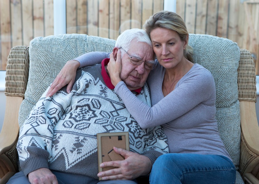 dad and daughter remembering a departed loved one.jpg