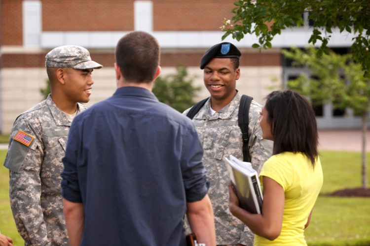 Military students and peers on campus, symbolizing the impact of scholarships provided in honor of veterans